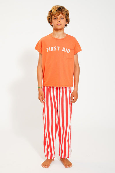 t'shirt | orange w/ "first aid" print